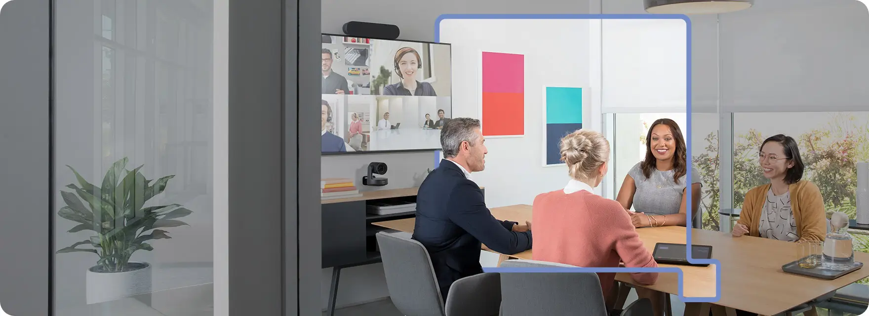 3 people video conferencing other team members presumably via Hybrid Workplace